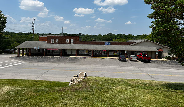 photo of strip center with parking lot.